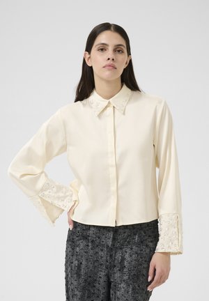 Blusa - egret