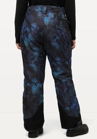 Sneeuwbroeken met een zwart en blauw abstract patroon, voorzien van een hoge taille, achterzakken en verstevigde onderbenen.