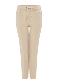 Pantalon beige fuselé avec cordon à l'avant, détails des coutures le long des jambes et poches latérales, présenté sur fond blanc.