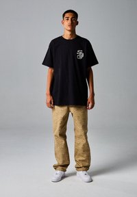 Grimey X SK8LAND - Pantaloni - marron