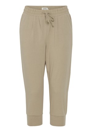 Beige jogger pants made of soft fabric, featuring an elastic waistband with a drawstring, side pockets, and cuffed ankles.