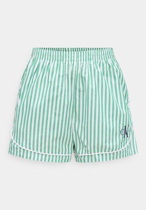Grün-weiß gestreifte Shorts mit elastischem Bund, weißen Paspeln und kleinem schwarzem Calvin Klein Logo am unteren rechten Bein.