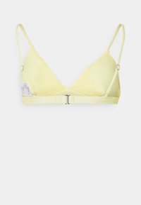 Gul trekantet bralette med justerbare stropper, prikkete bånd og krok-lukking. Glatt materiale med en minimalistisk design.