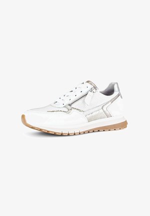 White sneaker with beige sole, metallic silver accents, mesh and leather textures, lace-up front, and side zipper detail.