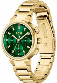 Orologio in acciaio inossidabile dorato con quadrante verde, tre quadranti secondari e indici simili a diamanti. Bracciale in stile con finitura lucida.