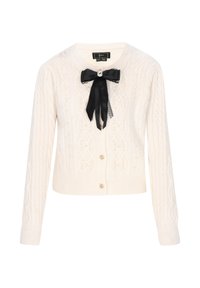 Cardigan bianco lavorato a maglia con motivo a treccia, scollatura tonda, fiocco in satin nero con pizzo e dettagli in perle. Chiusura frontale con bottoni.