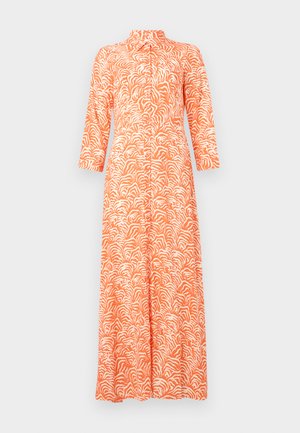 Pikk, oranž kleit, millel on valge abstraktne laine muster, kõrge krae ja kolmveerandi varrukad. Valmistatud kergest kangast.