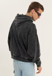 YOURTURN UNISEX - Sweater met rits - black