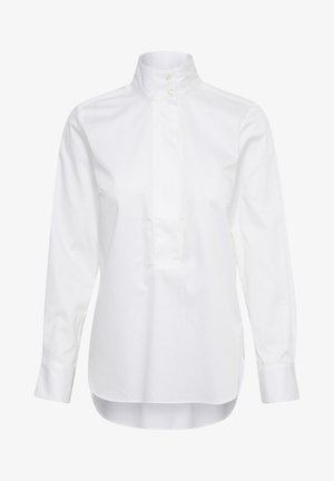 White long-sleeve shirt made of cotton. Features a high collar, button placket, and a slightly longer back hem. Smooth texture.