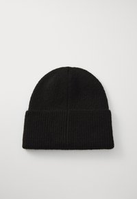 Black knitted beanie featuring a ribbed texture, rounded shape, and a folded cuff. Material appears soft and warm.