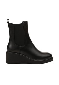 Bottines en cuir noir avec des panneaux latéraux en élastique, bout rond et semelle compensée. Équipées d'une languette à l'arrière pour un enfilage facile.