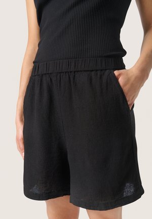 Zwarte linnen shorts met een elastische tailleband en zijzakken, met een relaxte pasvorm en een gestructureerde afwerking.