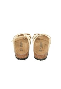 Sandali bianchi con cinturini, suola in sughero e suola in gomma nera. Presentano cinturini regolabili e una soletta testurizzata per il comfort. Taglia 36.