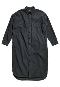 Chemise noire à manches longues en coton, avec col boutonné, poche avant et ourlet arrondi. Tissu texturé avec fermeture par boutons.