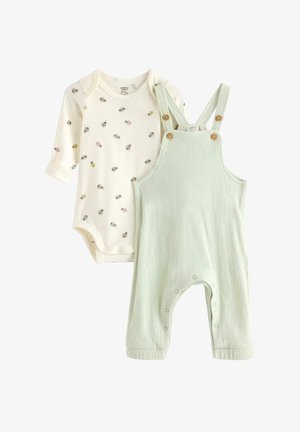 Kremfarvet babyheldragt med lange ærmer og flerfarvet mariehøneprint, kombineret med lysegrønne teksturerede bomuldsbukser med træknapper og tryklåse ved benene.