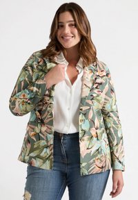 Floral pattern blazer in multicolored tones with a green base, featuring notched lapels, two buttons, and a single front pocket.