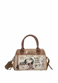 Sac à main beige avec poignées marron, présentant des illustrations artistiques et du texte. Texture lisse avec des ferrures décoratives et une bandoulière amovible.
