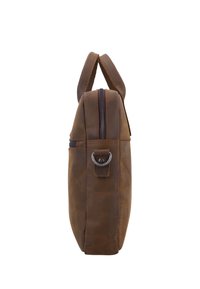 Brown leather briefcase viewed from the side, showing zipper, handle loop, and metal ring attachment on a plain white background.