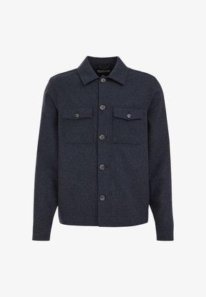 Tumehall villasegu nööpidega jakk, millel on pikad varrukad, lahtine kaelus ja ees kaks rinnataskut nööbitavate lappidena.