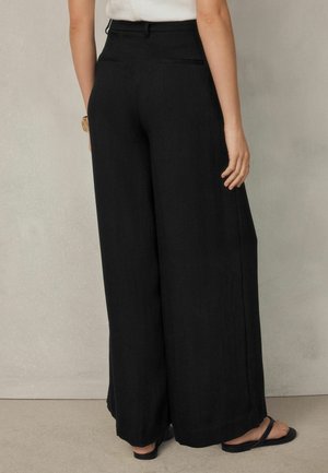 Next, PETITE FIT - CRINKLE PALAZZO TROUSERS . - Trousers - black