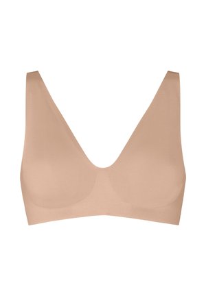 Nahtloser, hautfarbener, kabelloser BH mit breiten Trägern und tiefem V-Ausschnitt, entworfen für Komfort und eine glatte Passform.