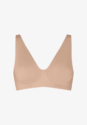 Nahtloser, hautfarbener, kabelloser BH mit breiten Trägern und tiefem V-Ausschnitt, entworfen für Komfort und eine glatte Passform.