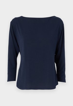 Marineblaue Langarmbluse aus weichem Stoff, mit weitem Ausschnitt und lockerer Passform, geradem Saum und minimalen Nähten.