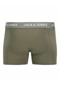 Zöld elasztikus anyagú boxer nadrág puha derékkal, amelyen fehér betűkkel a "JACK & JONES" felirat található. Simaság és feszes kialakítás jellemzi.