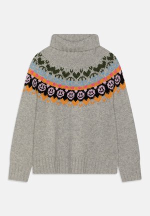 Pull en tricot gris à col roulé avec un empiècement coloré orné de motifs floraux et de smileys en rose, noir, orange, bleu et vert.