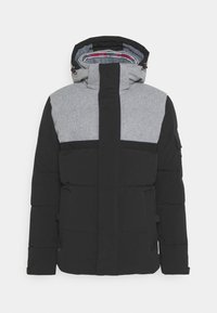 Chaqueta acolchada en negro y gris con capucha, que presenta un cierre de cremallera frontal, dos bolsillos laterales y un diseño en bloques de color, confeccionada con materiales suaves e insulating.