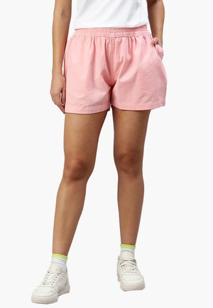 Shorts in cotone rosa con cintura elastica, tasche laterali e vestibilità rilassata. Tessuto liscio e design informale adatto per il clima caldo.
