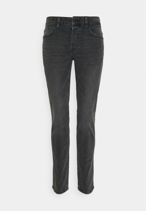 Sorte denim jeans med lige ben, fem lommer og diskret syning på sømmene. Stoffet har en glat, let tekstureret overflade.