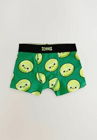 Boxers verts avec des visages souriants de balles de tennis et une ceinture noire portant l'inscription "TENNIS" en lettres vert clair.