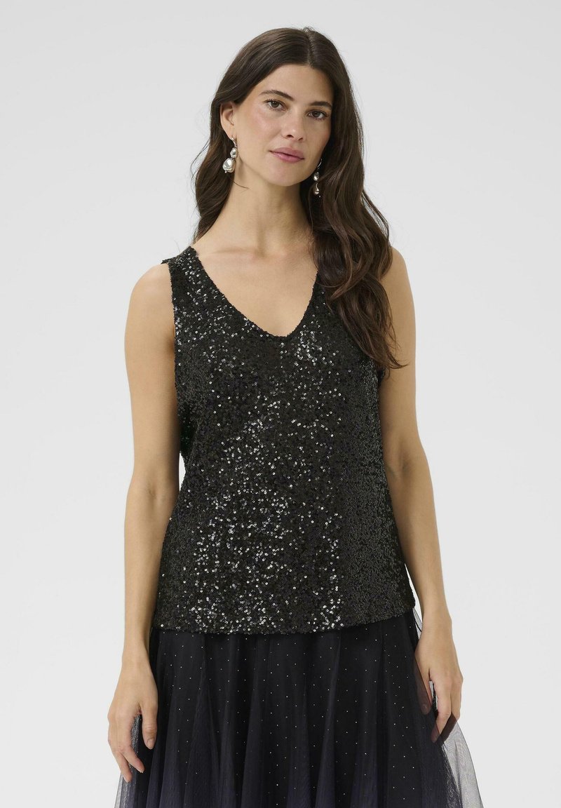 Top sin mangas de lentejuelas negras con un diseño de escote en V. Superficie suave con acentos reflectantes, combinado con una falda de tul con capas.