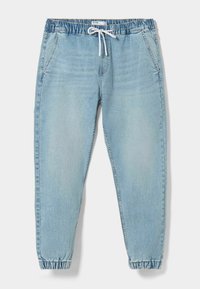 Light blue denim jogger pants with elastic waist, adjustable drawstring, side pockets, and tapered cuffs. Smooth texture with slight fading.