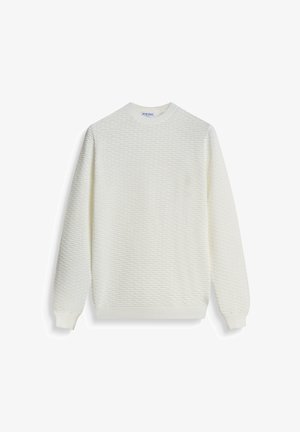 Maglione bianco a trama con scollatura rotonda, polsini e orlo a coste. Presenta un motivo in rilievo su tutta la stoffa.