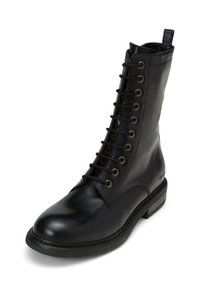 Black leather lace-up combat boot with a rounded toe, high ankle, and pull tab at the back, shown on a white background.