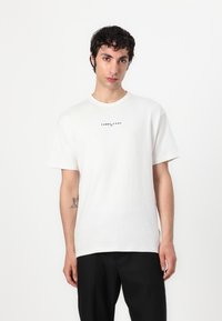 Tommy Jeans LOGO TEE - Trükipildiga T-särk - ecru