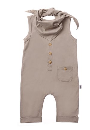 Beige cotton overall with sleeveless design, button placket, chest pocket, and matching scarf. Rolled cuffs at the leg openings.