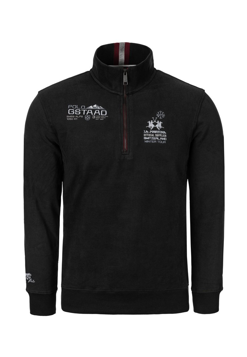 Černý flísový pulovr s vysokým límcem, půlzipem, vyšívanými logy v bílé a červené barvě a žebrovanými manžetami a lemem. Měkká textura.