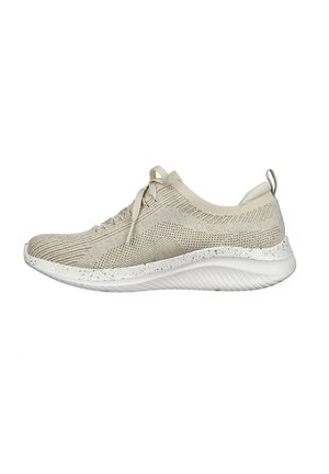 Beige knit athletic shoe with a white speckled sole. Features a rounded toe, lace-up front, and a pull tab at the heel for easy wear.