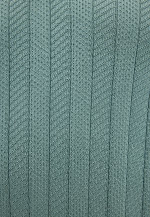 Knitted fabric in a soft teal color, featuring vertical stripes with a textured pattern and subtle dimensionality.