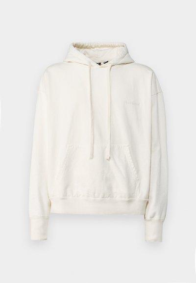 Cream-colored hooded sweatshirt made of soft fabric, featuring a front pocket, drawstring hood, and ribbed cuffs and hem.