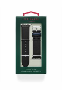 Black leather watch bands, one with silver hardware and the other with a blue accent, packaged in a green box labeled Ted Baker London.