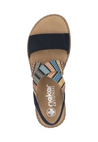 Slide sandal with black fabric straps and colorful patterned bands. Soft beige insole with "rieker ANTISTRESS" logo. Textured brown outsole.
