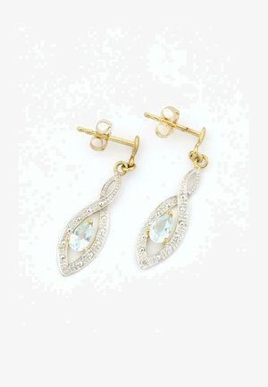 Hõbedased ripatsikõrvarõngad keerdunud lehe kujundusega, millel on helesinine tilgutav kivi ja kuldsed aksessuaarid.