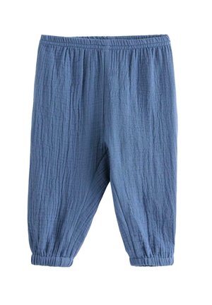 Blå bukser i tekstureret stof med elastisk talje og elastiske manchetter, løs pasform og afslappet stil.