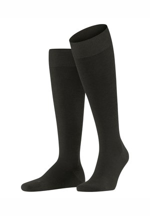 Knee-high socks in a solid black color, made from textured fabric with ribbed cuffs and smooth foot sections for comfort and fit.