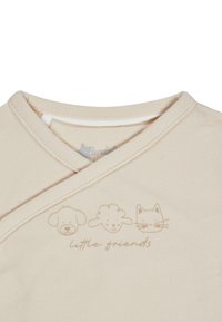 Beige baby wrap shirt with simple animal faces of a dog, sheep, and cat above the text "little friends" on the chest area.
