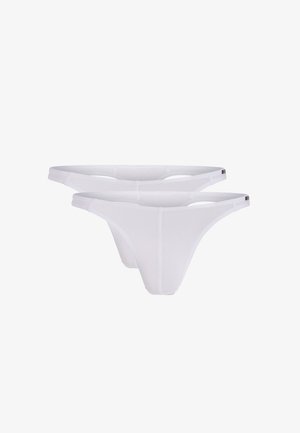 White cotton thong underwear with thin elastic straps and a seamless design. Two pairs displayed together, featuring a textured fabric finish.
